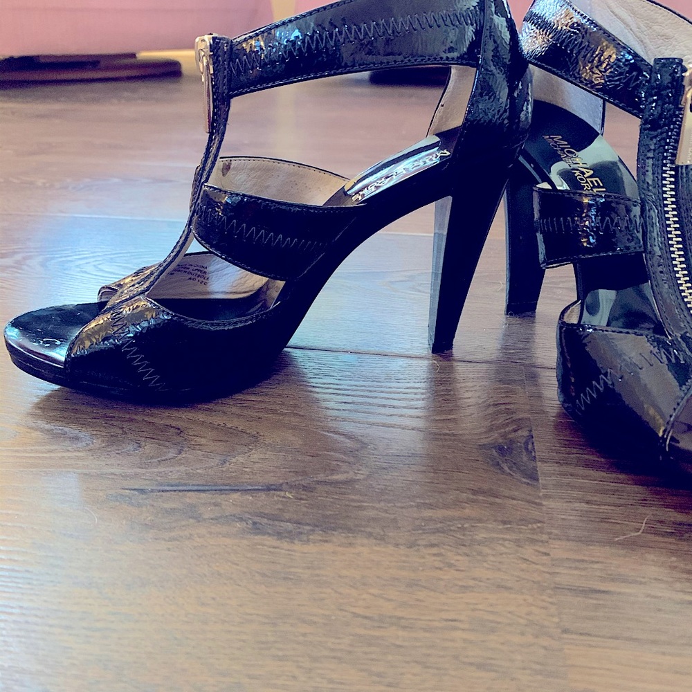 Black patent leather 4” heels with nonslip sole.